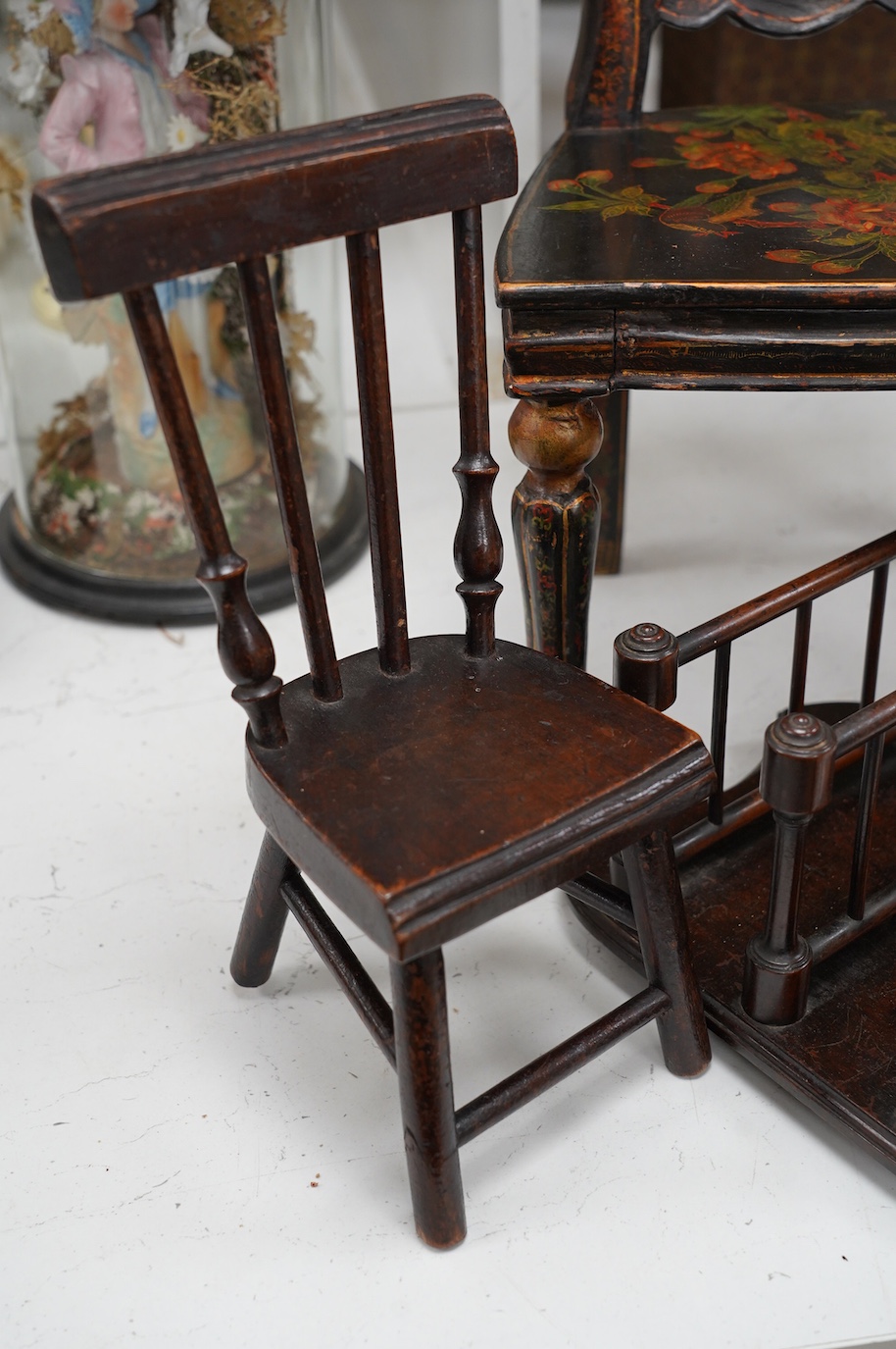 Two miniature single chairs and a spindle turned stationery rack, largest 45cm high. Condition - fair, largest chair repaired